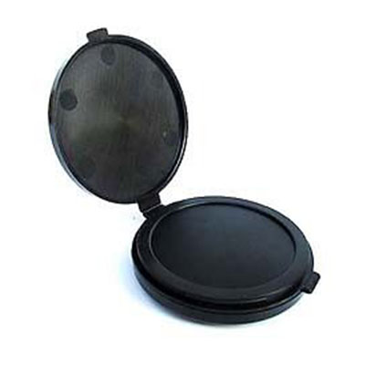 A black round compact mirror with a small hole in it.